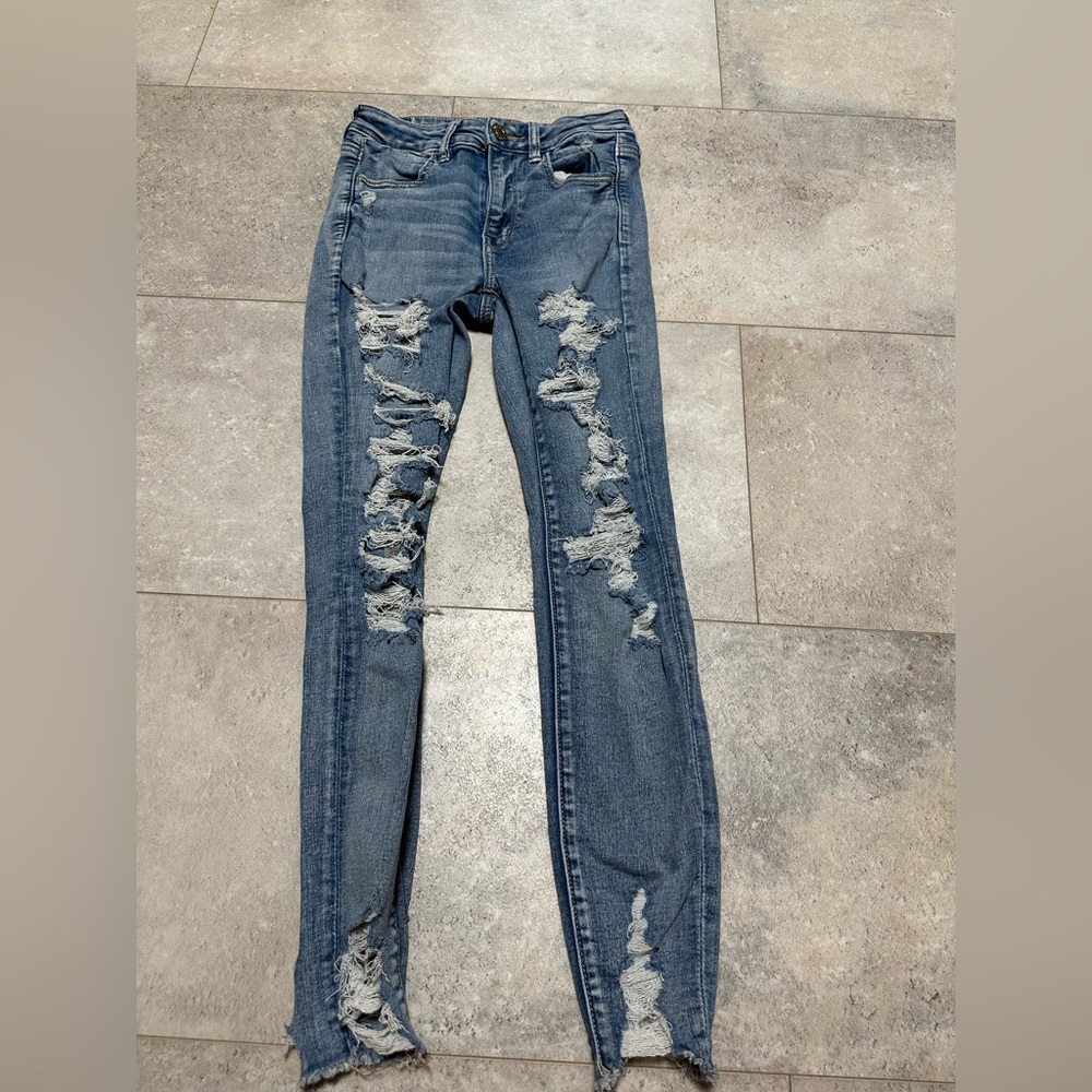 American Eagle “next level stretch” distressed hi-rise jeggings size 4